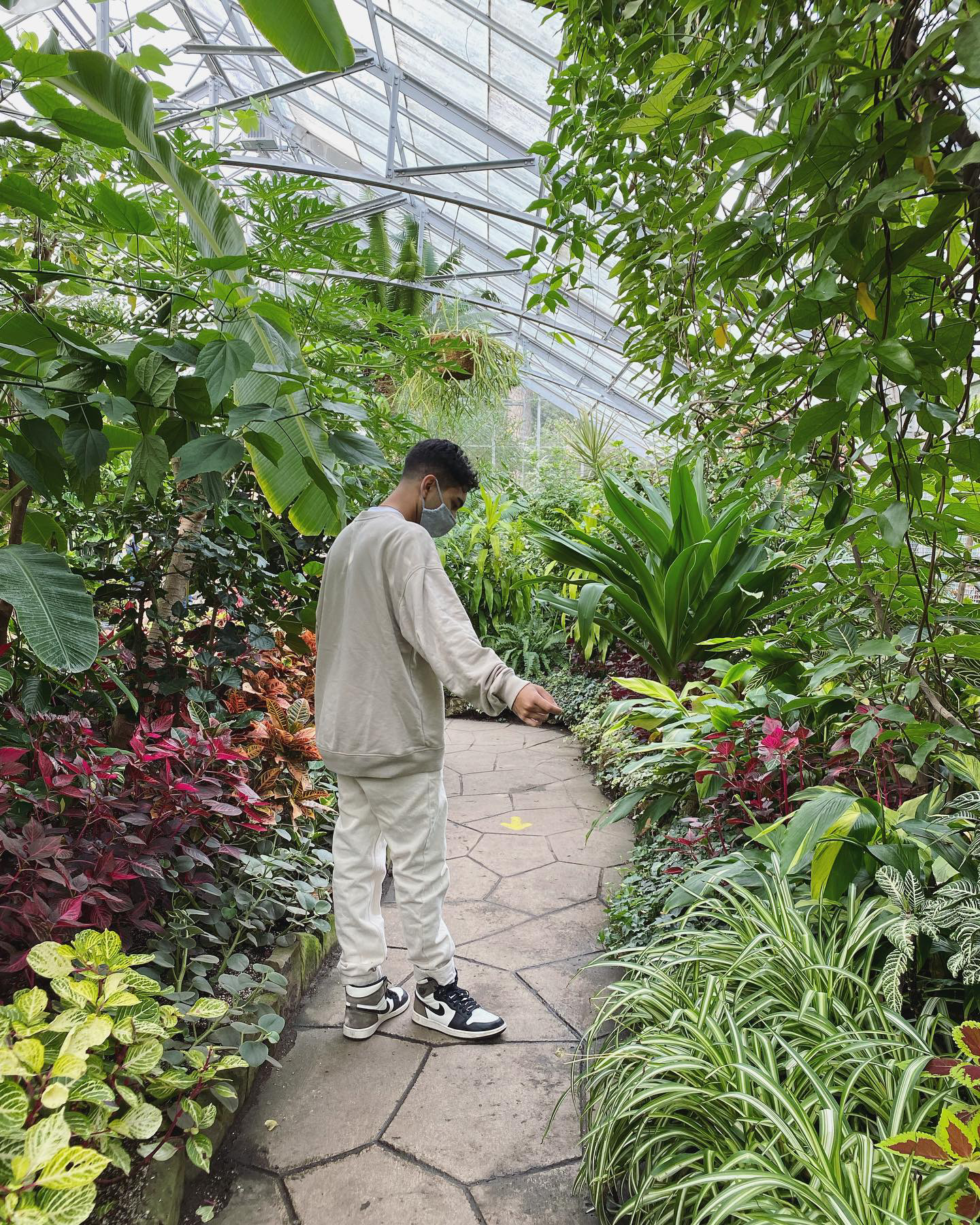 Jane leaning against a bus